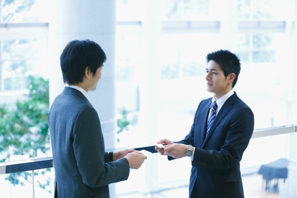 Business cards should be presented and received with both hands.